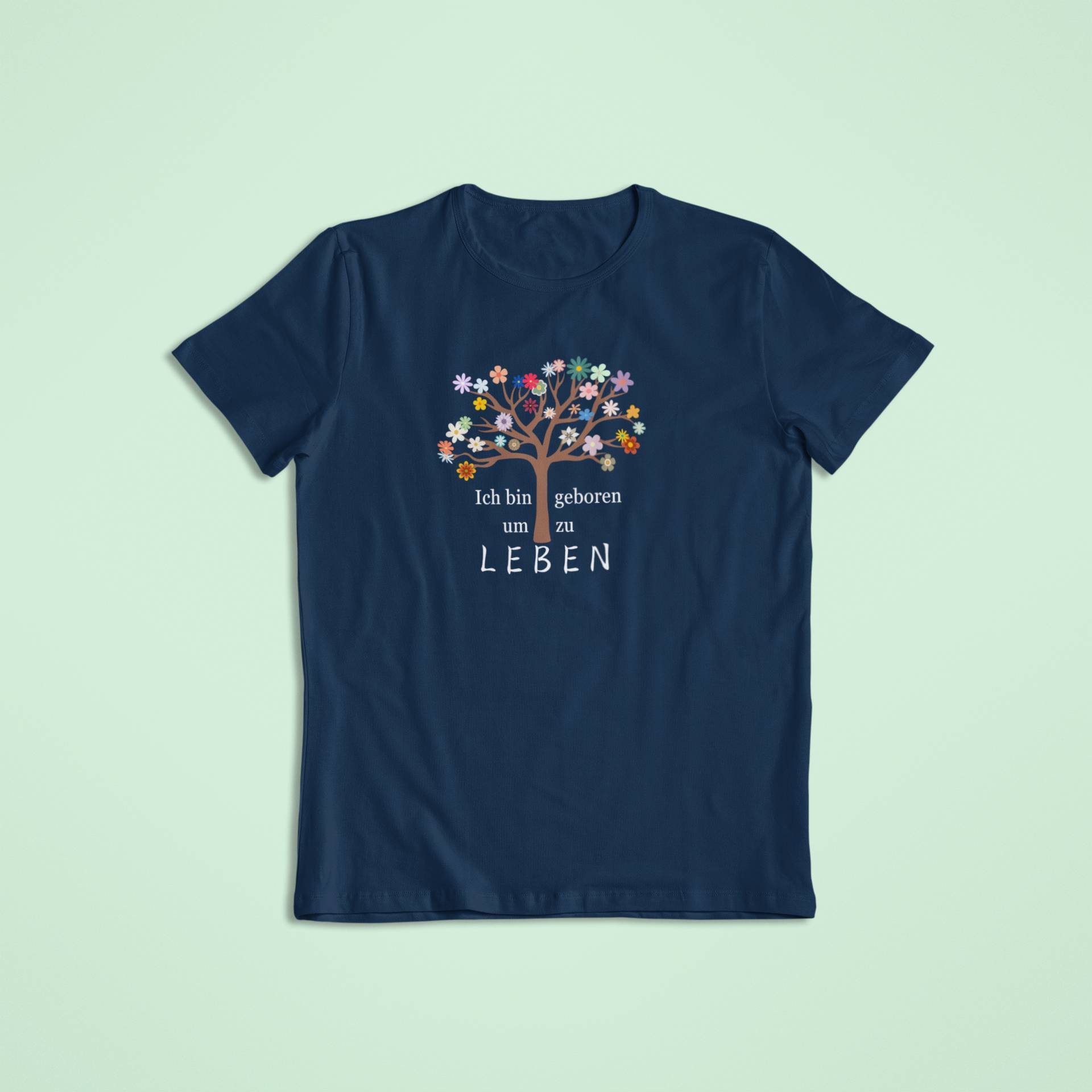 Navyblaues Kindershirt mit floralem Lebensbaum-Motiv und dem Statement „Ich bin geboren um zu leben“.