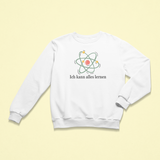 Weißes Kinder-Sweatshirt mit der Aufschrift „Ich kann alles lernen“ unter einer stilisierten bunten Atom-Grafik. Das Design vermittelt Neugier, Lernfreude und Wachstum.