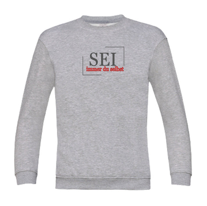 Kindersweatshirt mit bestärkender Aufschrift „Sei immer du selbst“ – achtsame Kleidung für Kinder, handbedruckt und fair produziert in Deutschland.